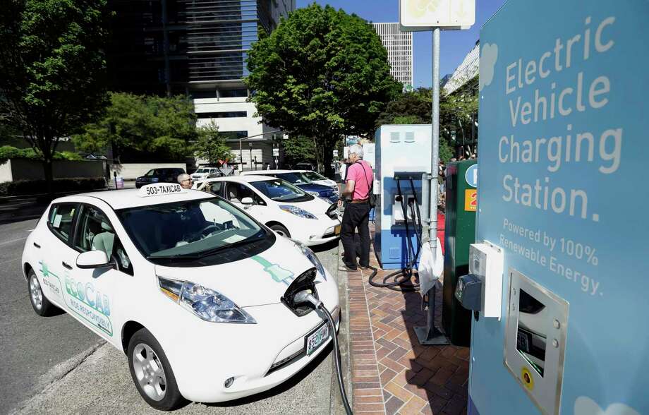 abbott-signs-electric-car-rebates-into-law-houston-chronicle