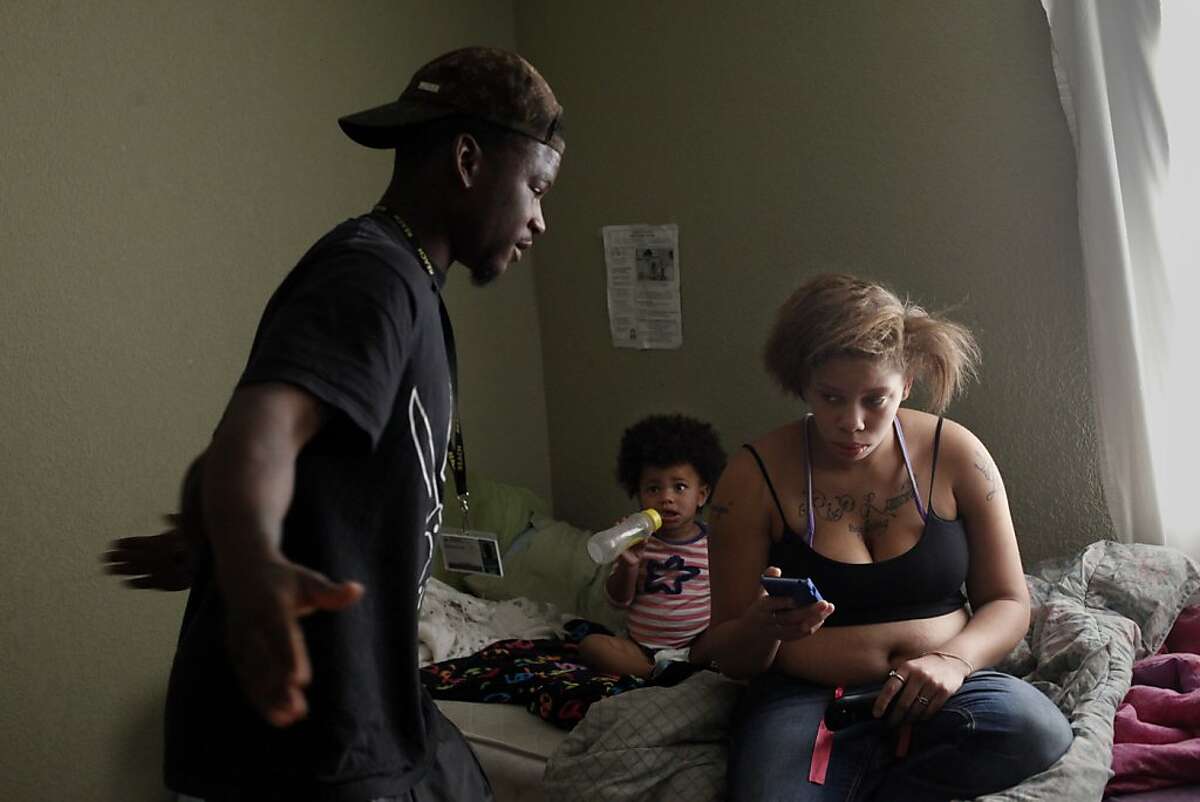 Quindell Anderson gets angry as he talks with Brijjanna Price while she sits on their bed next to their daughter LaMya Deshana Price, Wednesday, November 6, 2013, in Hayward, Calif. Photo: Lacy Atkins, The Chronicle