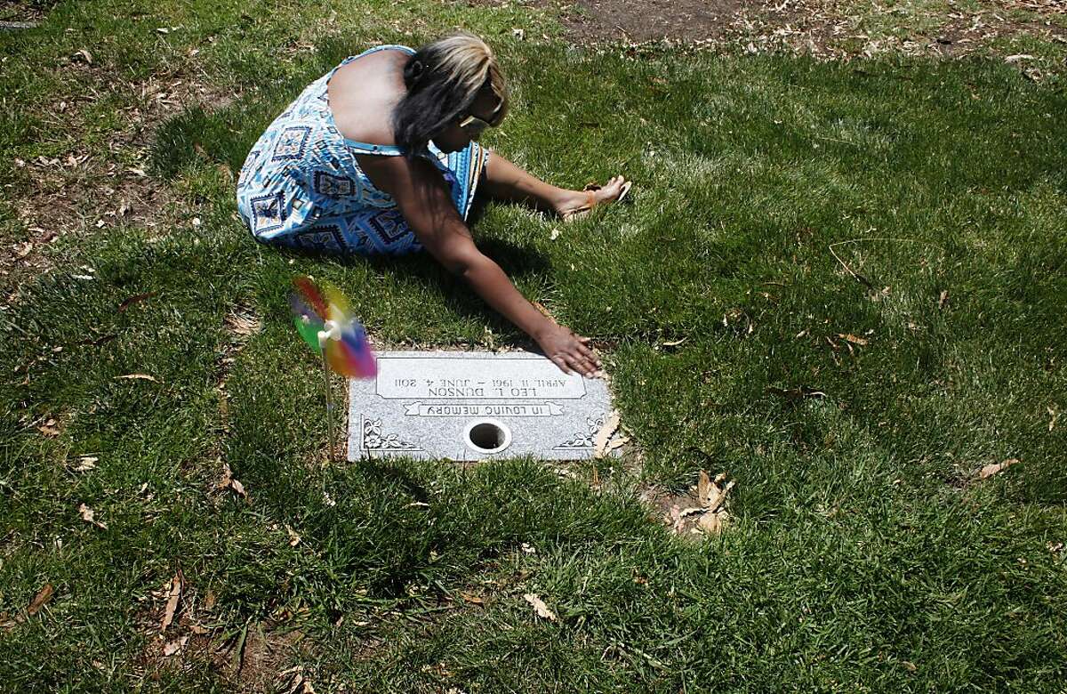 Nicole Hodge visits her stepson, Lamont Price's gravesite on the first birthday since his death, Wednesday July 4, 2012, at  the Rolling Hill Cemetery in Richmond, Calif. Photo: Lacy Atkins, The Chronicle