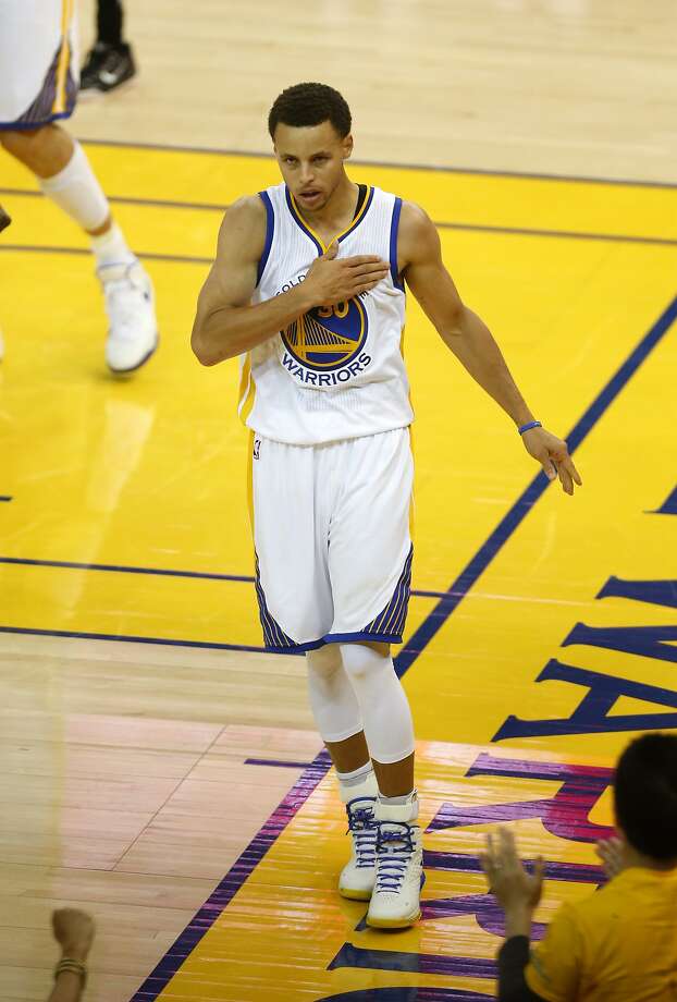 Golden State Warriors guard Stephen Curry celebrates after being fouled by New Orleans forward Ryan Anderson while scoring two points during the second quarter of Game 1 of the NBA Western Conference 1st Round on Saturday, April 18, 2015 in Oakland, Calif. Photo: Beck Diefenbach, Special To The Chronicle