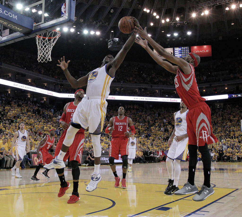 Warrior Draymond Green (23) and Rockets Corey Brewer go after a rebound during Game 1 of the Western Conference Finals on Tuesday, May 19, 2015 in Oakland, Calif. Photo: Carlos Avila Gonzalez / The Chronicle / ONLINE_YES