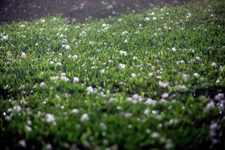 Golf ball-sized hail that fell about 10 p.m. April 11, 2016 covers the back yard of a home near the intersection of Nacogdoches and Loop 410 in San Antonio. Photo: William Luther, San Antonio Express-News / © 2016 San Antonio Express-News