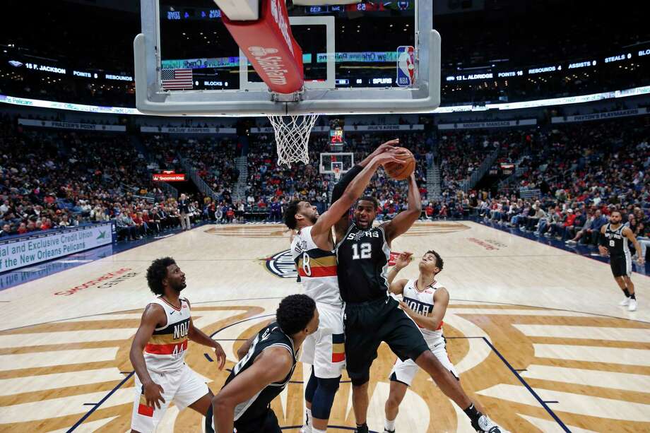   San Antonio Spurs forward LaMarcus Aldridge (12) works against New Orleans Pelicans forward (23) in the first half of an NBA basketball game in New Orleans on Wednesday, November 22 of 2017. (AP Photo / Scott Threlkeld) Photo: Scott Threlkeld, Associated Press / FR171144 AP 