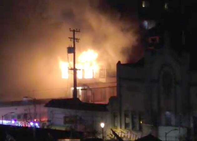 Oakland firefighters pull person from burning Victorian