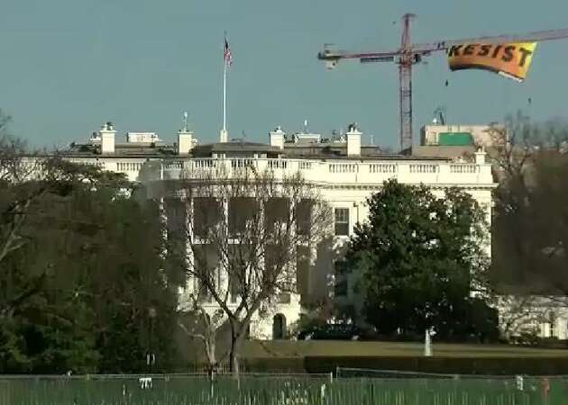 Bay Area residents charged with commandeering crane to unfurl 'Resist' banner behind White House