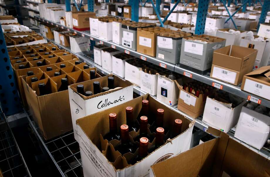 Cases of wine from Northern California wineries are stocked on shelves at the WineDirect warehouse in American Canyon. Photo: Paul Chinn, The Chronicle