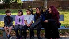 From left: Danyal Nasseri, 7, with his siblings Iman, 9, Jennah, 12, Diana, 14, and mother Habiba at the park on Saturday, Nov. 18, 2017, in Santa Clara, Calif. Habiba participated in a study to share her genetic data with UCSF and Color Genomics.
